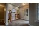 Welcoming entryway with tile floors, decorative console table, and charming accents creating a warm and inviting atmosphere at 12426 W Cougar Dr, Sun City West, AZ 85375