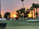 Scenic view of the golf course at sunset, complete with sand traps and lush green grass at 12426 W Cougar Dr, Sun City West, AZ 85375