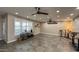 Spacious living room with modern ceiling fans and tile flooring, great for entertaining at 12426 W Cougar Dr, Sun City West, AZ 85375