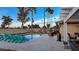 Sparkling pool with a patio, jacuzzi and lounge chairs overlooking the golf course at 12426 W Cougar Dr, Sun City West, AZ 85375