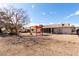 Spacious backyard with desert landscaping, a shade structure, and a view of the house at 12630 W Crystal Lake Dr, Sun City West, AZ 85375