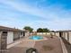 Private backyard features a sparkling pool, lush landscaping, and a charming outdoor living space at 1329 N 25Th St, Mesa, AZ 85213