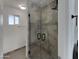 Modern bathroom featuring glass enclosed shower and tiled walls at 1329 N 25Th St, Mesa, AZ 85213