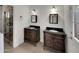 Elegant bathroom featuring dual vanities with granite tops and a glass-enclosed walk-in shower at 1329 N 25Th St, Mesa, AZ 85213