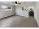 Bedroom featuring an open doorway to bathroom and backyard views at 1329 N 25Th St, Mesa, AZ 85213