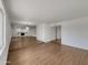 Spacious open-concept living area with wooden floors and bright white walls at 1329 N 25Th St, Mesa, AZ 85213