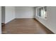 Bright living room featuring light walls, wood floors, and large windows at 1329 N 25Th St, Mesa, AZ 85213