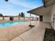 Backyard featuring a sparkling blue pool with a covered patio at 1329 N 25Th St, Mesa, AZ 85213