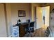 Bedroom with wood-look floors and adjacent door to another room at 13808 N 108Th Dr, Sun City, AZ 85351