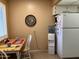 Kitchen nook with breakfast table, water cooler, and natural light at 13808 N 108Th Dr, Sun City, AZ 85351