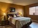 Inviting main bedroom with an earthy color palette and natural light at 13808 N 108Th Dr, Sun City, AZ 85351