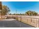 Balcony with metal railing overlooking the street and landscaping at 1438 S 30Th St, Mesa, AZ 85204