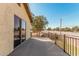 Balcony with metal railing, large tree and sliding glass door access at 1438 S 30Th St, Mesa, AZ 85204