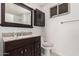 Bathroom featuring a granite countertop vanity and mirror cabinet at 1438 S 30Th St, Mesa, AZ 85204