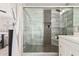 Elegant walk-in shower with glass door and built-in shelving in the en-suite bathroom at 1438 S 30Th St, Mesa, AZ 85204