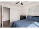 Bedroom featuring a closet with sliding doors and a dresser at 1438 S 30Th St, Mesa, AZ 85204