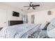 Bedroom with a mounted TV, closet, and view of the en-suite bathroom at 1438 S 30Th St, Mesa, AZ 85204