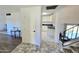 A bright foyer features neutral flooring, white walls, and a glimpse into the updated kitchen at 1438 S 30Th St, Mesa, AZ 85204