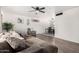 Comfortable living room featuring a gray sectional sofa, ceiling fan, and bright natural light at 1438 S 30Th St, Mesa, AZ 85204