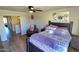 Relaxing primary bedroom with a ceiling fan, a side chair, and ample natural light at 1438 S 30Th St, Mesa, AZ 85204