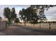 Scenic view of a community park with mature trees lining a walking path at 1438 S 30Th St, Mesa, AZ 85204