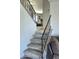 View of the carpeted staircase and railing, leading up to the second floor at 1438 S 30Th St, Mesa, AZ 85204