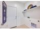 Laundry room with a door, shelving and decor at 14925 W Hackamore Dr, Surprise, AZ 85387