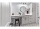 Well-lit bathroom featuring stylish vanity, round mirror, and modern fixtures at 1576 E Jasper Ct # E, Gilbert, AZ 85296