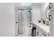 Bright bathroom featuring black hardware, a shower with a curtain, and unique tiled floors at 1576 E Jasper Ct # E, Gilbert, AZ 85296