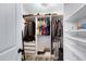 Walk-in closet offers custom shelving and ample storage for an organized wardrobe at 1576 E Jasper Ct # E, Gilbert, AZ 85296