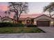 Charming single-story home with manicured lawn, mature trees, and a welcoming entrance at 16428 N 59Th St, Scottsdale, AZ 85254