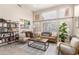 Bright living room with large windows, stylish furnishings, and a contemporary aesthetic at 16428 N 59Th St, Scottsdale, AZ 85254