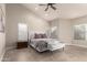 Spacious bedroom with vaulted ceiling, neutral tones, and large windows offering plenty of natural light at 16428 N 59Th St, Scottsdale, AZ 85254