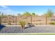 Backyard view features desert landscaping with gravel and drought-tolerant plants at 17618 W Paraiso Dr, Surprise, AZ 85387