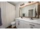 Bathroom with double sinks, marble countertops, and modern fixtures at 17618 W Paraiso Dr, Surprise, AZ 85387