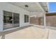 Covered patio featuring tile flooring and a sliding glass door leading to the interior of the home at 1881 E Erie St, Chandler, AZ 85225