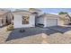 Charming single-story home with well-maintained landscaping and a tile roof at 1881 E Erie St, Chandler, AZ 85225