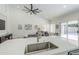 Spacious kitchen island overlooks a modern living area with natural lighting and an open floorplan at 1881 E Erie St, Chandler, AZ 85225