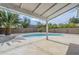 A refreshing private pool with a covered patio and mature landscaping at 1881 E Erie St, Chandler, AZ 85225