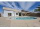 Backyard view of the pool and patio area with desert landscaping at 1881 E Erie St, Chandler, AZ 85225