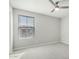 Bedroom featuring neutral paint, carpet, a ceiling fan, and a window at 19242 W Madison St, Buckeye, AZ 85326