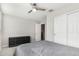 Bedroom featuring a ceiling fan, neutral paint, and a sliding closet door at 19242 W Madison St, Buckeye, AZ 85326