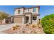 Beautiful two-story home featuring a two-car garage and mature landscaping at 19242 W Madison St, Buckeye, AZ 85326