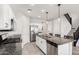 Clean kitchen featuring stainless steel appliances, granite countertops, and eat-in island at 19242 W Madison St, Buckeye, AZ 85326