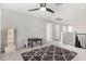 Versatile loft space with a ceiling fan, neutral decor, and ample natural light at 19242 W Madison St, Buckeye, AZ 85326