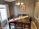 Charming dining area with dark wood table, tile flooring, and natural light at 2072 N Wildflower Ln, Casa Grande, AZ 85122