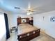 Well lit main bedroom showcasing a decorative, ornate bed frame and ceiling fan at 2072 N Wildflower Ln, Casa Grande, AZ 85122