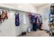 Walk-in closet with ample storage for clothes, shoes, and accessories at 20784 N Marina Ave, Maricopa, AZ 85139