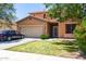 Charming two-story home features a well-maintained front lawn and a two-car garage at 20784 N Marina Ave, Maricopa, AZ 85139