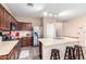 Kitchen with granite countertops, stainless steel appliances, tile backsplash, and kitchen island at 20784 N Marina Ave, Maricopa, AZ 85139